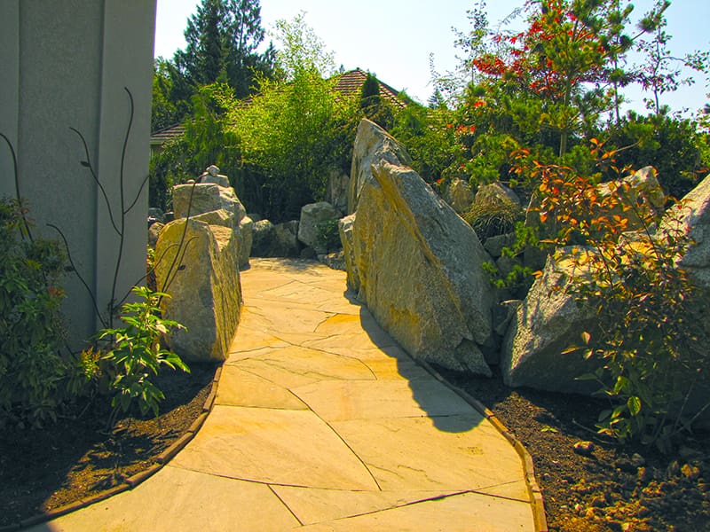 A pathway to a privacy screened garden