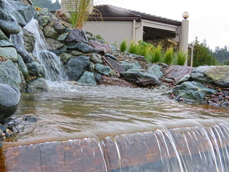 Water feature near outdoor kitchen in Skagit, CO