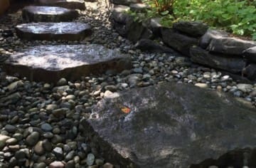 Giant Basalt Stepping Stones leading to a private garden deck