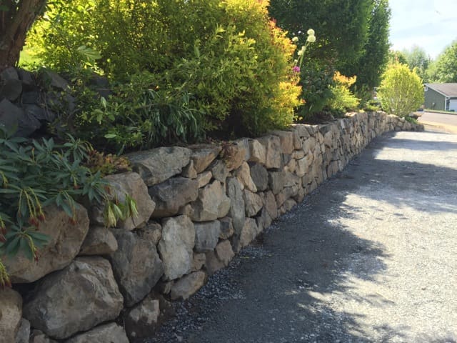 A Natural Quarry Stone Retaining Wall hardscape