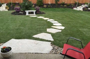 Flagstone stepping stones leading to a destination garden bench for your morning coffee...